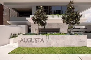 A modern building with a sign reading 'AUGUSTA BY MOSAIC' and '4 FIRST AVE.' - Luxury Villas Burleigh Bliss (Ocean Views) (Burleigh Heads)