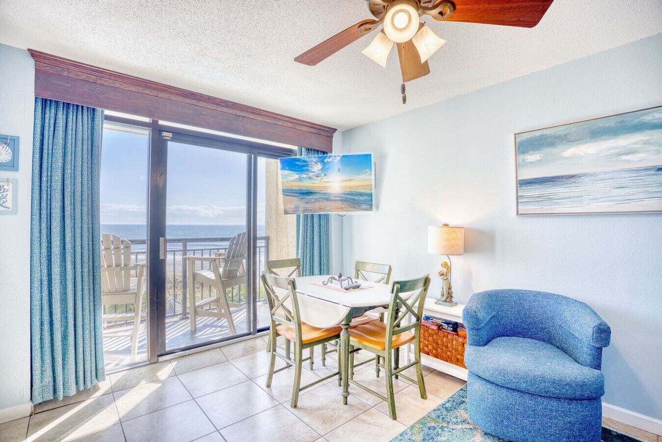 Oceanfront Livingroom and Dining Area with Big Screen 50` SmartTV.  Balcony has bar-height chairs (perfect for seeing over the railing) and a rocking chair for peaceful reading.  Enjoy the perfect view of the morning sunrise, pools, and beach.