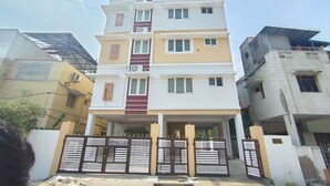 A multi-story residential building with a flat roof, multiple balconies, and a gated entrance. - CTS Residency (Tiruchirappalli)