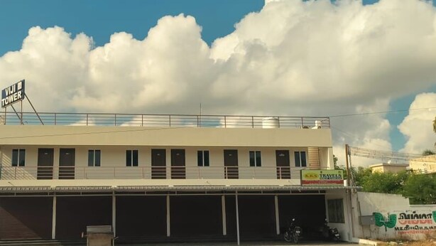 A building with a sign reading "VIJI TOWER" and a sign for "K.R.S. TRAVEL". - Viji Towers Tiruvannamalai (Tiruvannamalai)