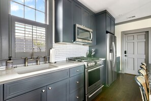 Fridge, microwave, oven, stovetop - The Rosemary House | Sleeps 16 | Multi-Unit Rental (Charleston)