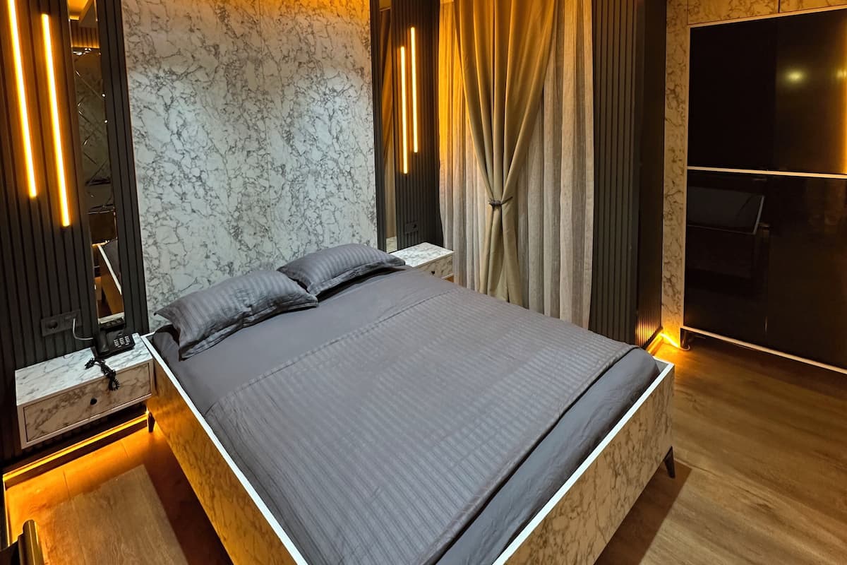 Deluxe Quadruple Room, Balcony, City View | 1 bedroom, Egyptian cotton sheets, premium bedding, minibar