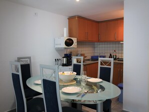 Dining - Peaceful Marina Apartment: Garden, Parking, Mooring, Near Beach, A/C, Wi-Fi (Roses)