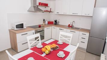 Apartment (One Bedroom Apartment) | Private kitchen | Fridge