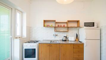 Apartment (Two Bedroom Apartment with Balcony an) | Living room | 32-inch flat-screen TV with cable channels