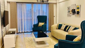 Classic Apartment, Balcony, City View | Living area | 24-inch Smart TV with digital channels