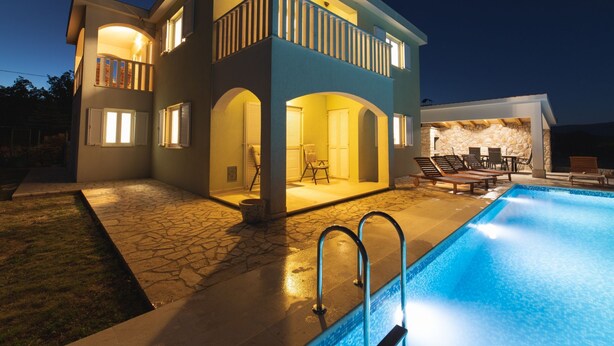 A two-story house with a swimming pool, outdoor seating, and a stone wall. - Idyllic Getaway Lovrec Villa With Pool (Lovrec)