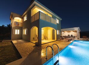 A two-story house with a swimming pool, outdoor seating, and a stone wall. - Idyllic Getaway Lovrec Villa With Pool (Lovrec)