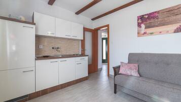 House (Two Bedroom Holiday Home with Pool) | Living room | 32-inch flat-screen TV with satellite channels