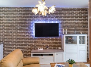 House (Six Bedroom Holiday Home) | Living room | 32-inch flat-screen TV with satellite channels - Relaxing Holiday Home With Pool, Fitness Area, and Entertainment Facilities (Marina)