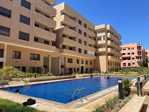 Chic 2-bedroom apartment with Pool ,WiFi, AC in vibrant Marrakesh.
