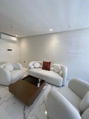 Living area - Chic 2-bedroom apartment with Pool ,WiFi, AC in vibrant Marrakesh.
 (Marrakesh)