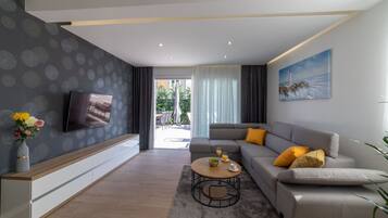 Villa (Four Bedroom Villa) | Living room | 32-inch flat-screen TV with satellite channels