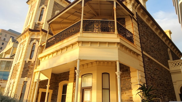 A historic building with a corner balcony, large windows, and a tower. - Seafield Tower Glenelg Apartment no 6 (Glenelg)