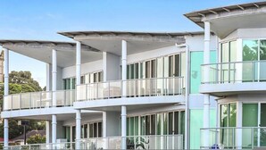 A modern building with multiple balconies and large windows. - Gallery Resort Style Penthouse no 13 (Victor Harbor)