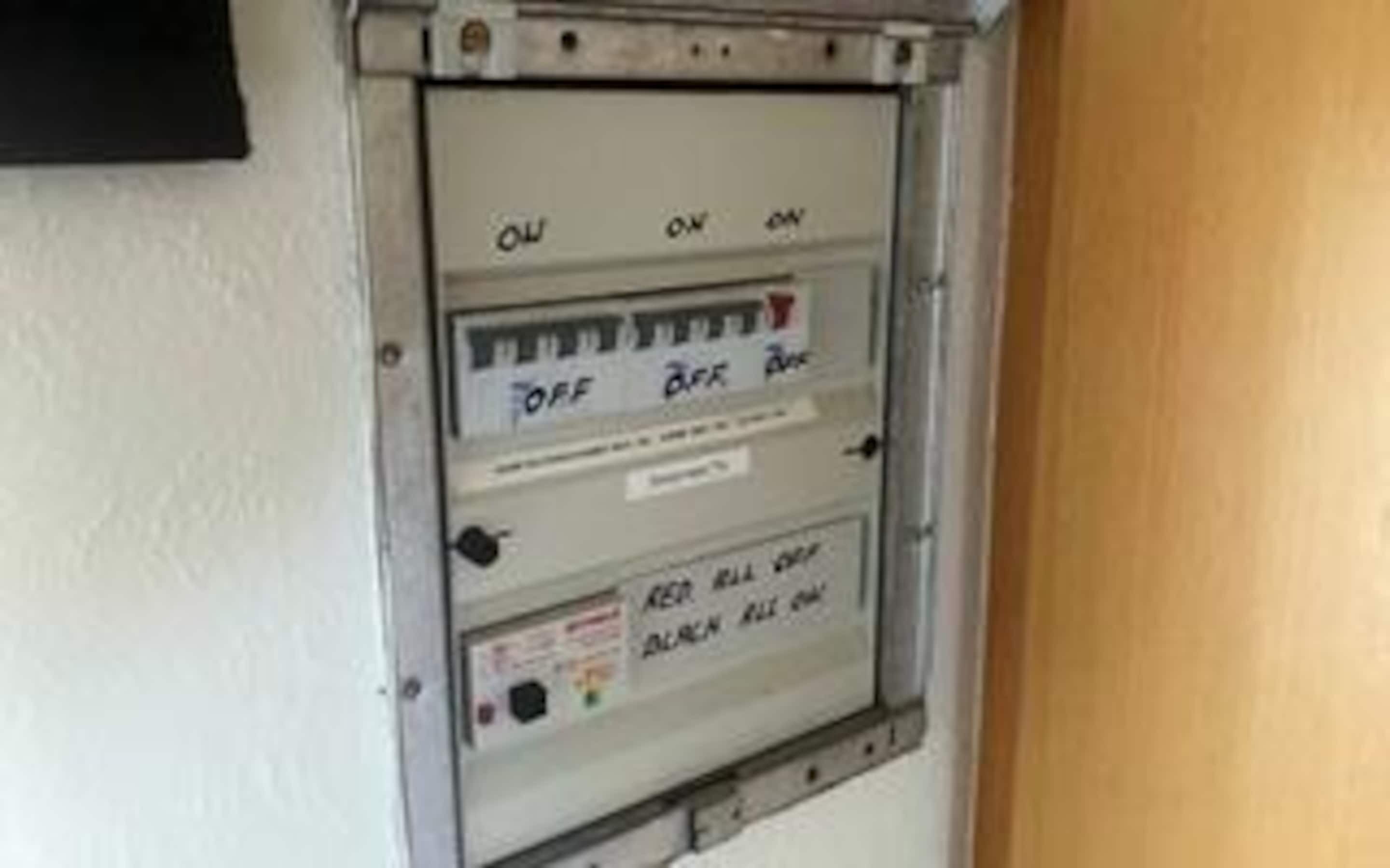 A utility panel with switches labeled 'OFF,' 'ON,' and 'ON.'