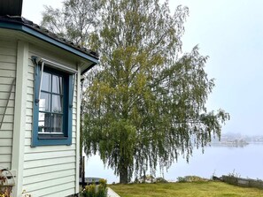 A house with a window and a view of a lake. - 4 Star Holiday Home in Amal (Åmål)