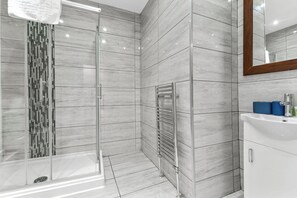 Shower, towels, soap, toilet paper