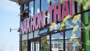 A building with a sign that reads "NAKHON THAI". - -15% LUX Riverside Duplex Masionette By LCY/ExCeL I 25min to Tower of London (London)