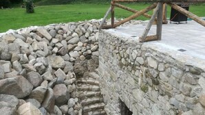 A stone well with a wooden staircase leading down. - Beautiful Villa With Spacious Rooms (Lešany)