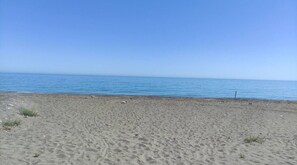 On the beach, sun-loungers, beach towels
