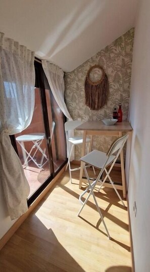 Cozy retreat with a sliding door to an outdoor area and a comfortable seating space.