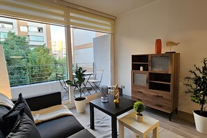 Apartamento | Área de estar | TV de tela plana