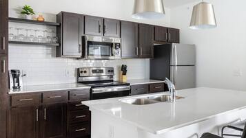 Fridge, dining tables, kitchen islands