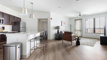 Fridge, dining tables, kitchen islands