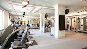 A gym with treadmills, weight machines, and mirrors. - Landing | Stylish Studio, Pool, Gym (Dallas)