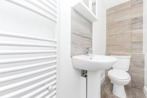 Shower, towels, soap, toilet paper