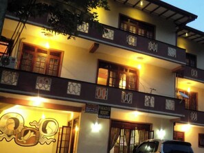 A multi-story building with a sign for Paradise Resort. - Kandy Paradise Resort (Kandy)