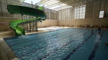 Swimmers can enjoy the pool with clear lanes and a large water slide.