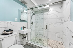 Shower, hair dryer, towels, soap