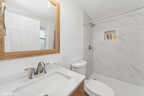 Shower, hair dryer, towels, soap