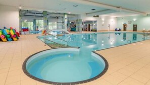 An indoor swimming pool with a clear water area, a diving board, and colorful pool toys. - 2 Bed Lodge Sleeps 5 - Pet Friendly, Wifi, Parking (Skegness)