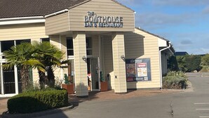 A building with a sign reading "The Boothouse Bar & Restaurant" and a menu board advertising offers. - 2 Bed Lodge Sleeps 5 - Pet Friendly, Wifi, Parking (Skegness)