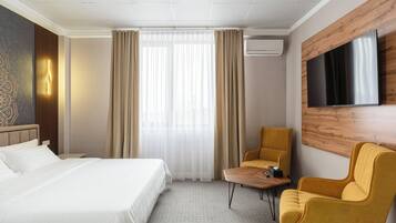 Luxe beddengoed, een kluis op de kamer, een strijkplank/strijkijzer