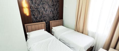 Luxe beddengoed, een kluis op de kamer, een strijkplank/strijkijzer