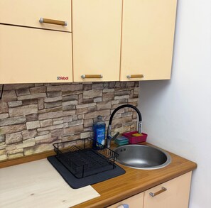 Fridge, microwave, electric kettle, cookware/dishes/utensils