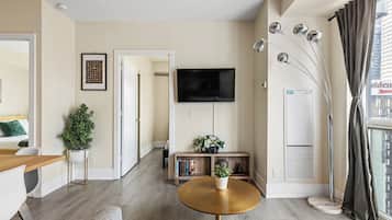 Deluxe Condo, 3 Bedrooms, Balcony, City View | Living area | 45-inch flat-screen TV with cable channels