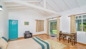A bedroom with a bed, a desk, and a chair. There is a door, a window, and a view of the outside. - Amy's Haven (Wadduwa)