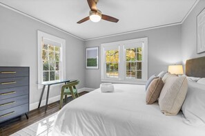 A bedroom with a bed, a desk, and a chair. - Modern Villa w Pool, Hot Tub & Games! (Greensboro)