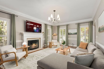 Tranquil and airy living room with fireplace
