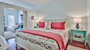 A bedroom with a bed, a nightstand, a lamp, and a ceiling fan. - One Bedroom, 620 Sq Ft, Seacrest Beach, Free Bikes (Panama City Beach)