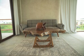 Suite Deluxe, vue partielle sur l'océan | Coin séjour