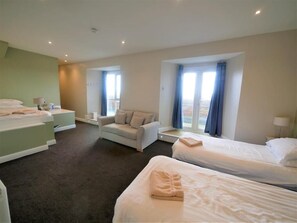 Family Room, Balcony, Sea View | In-room safe, iron/ironing board, free WiFi, bed sheets