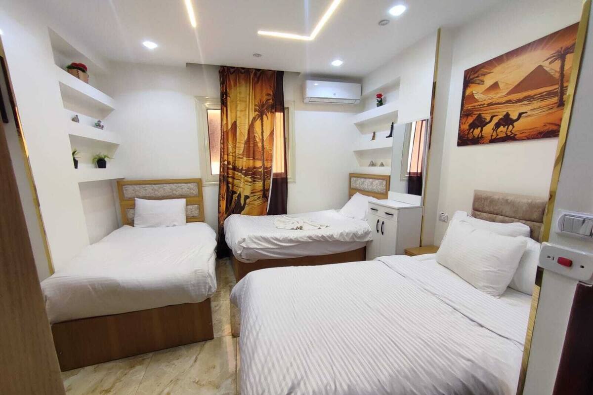 Standard Triple Room, City View | Pillowtop beds, minibar, soundproofing, iron/ironing board