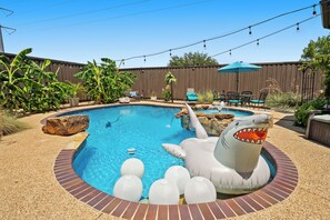 Outdoor pool, a heated pool - Luxe 5BD Home, Heated Pool, Game Room, King Beds, Family-Friendly (Plano)