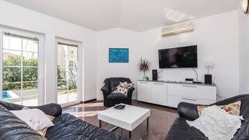 Comfort Villa, 3 Bedrooms, Pool View | Living area | 70-inch TV with digital channels